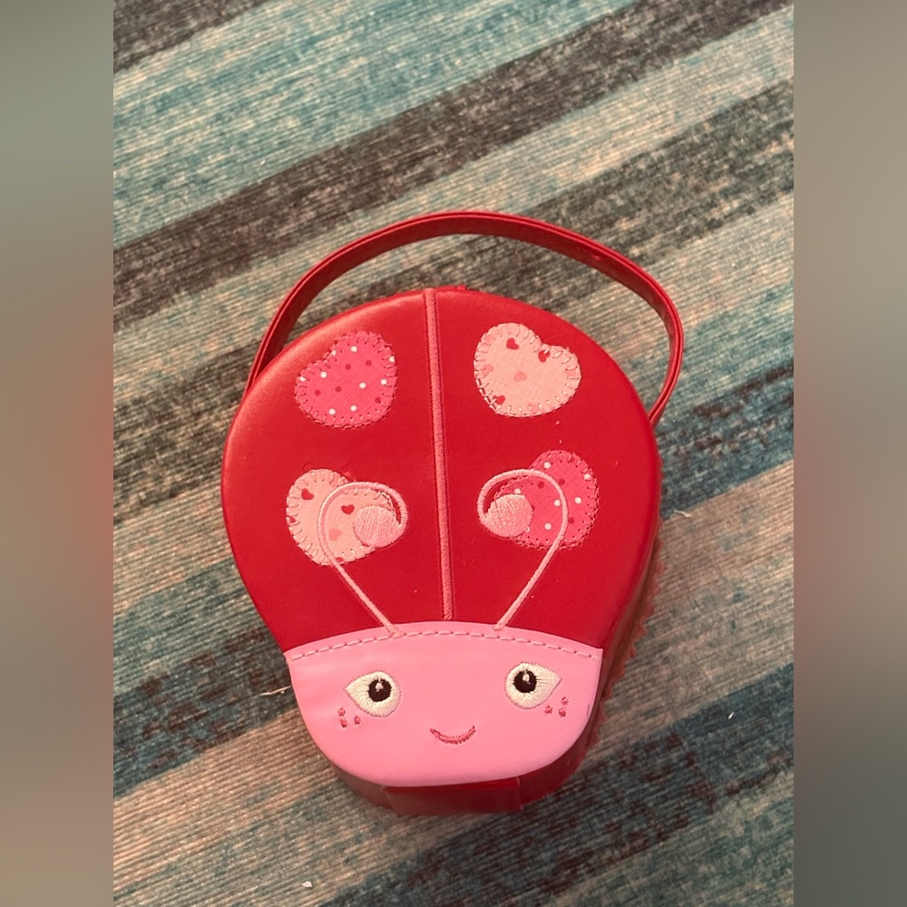 NWOT red and pink ladybug shaped travel jewelry holder/box